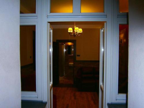 a hallway with a door leading to a room at Art Apartments in Poznań