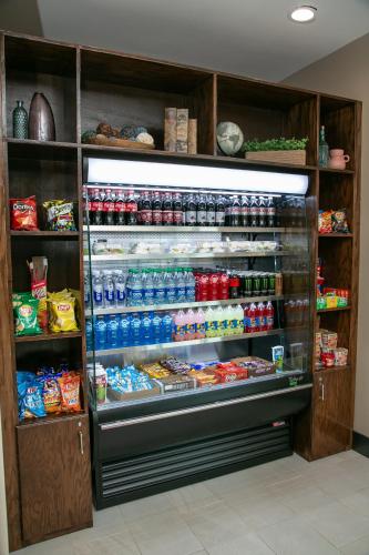 a refrigerator filled with lots of food and drinks at Holiday Inn Metairie New Orleans by IHG in Metairie