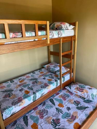 two bunk beds in a small room with at Casa Cariri- Preá in Prea
