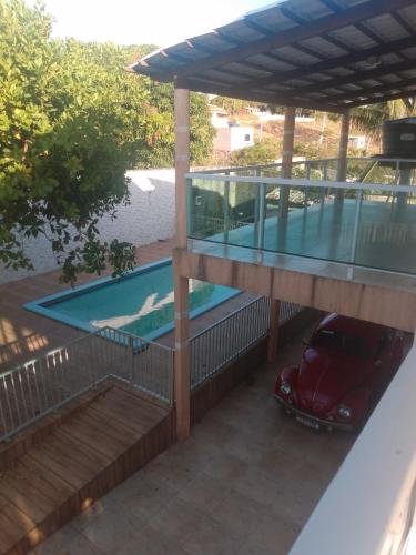 a view of a swimming pool from the balcony of a house at Casa de Dona Aida in Itaparica