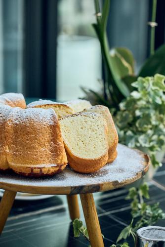 two slices of bread sitting on a wooden table at La Fleur Boutique Hotel in Tivat