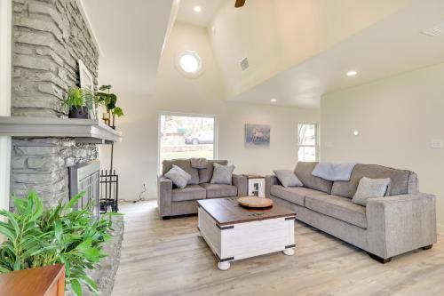 a living room with two couches and a fireplace at Serene Burnet Getaway with Buchanan Lake Views! in Burnet