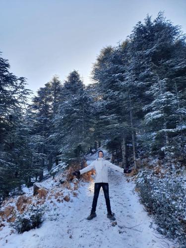 a person standing on a path in the snow at azila _ issagun 