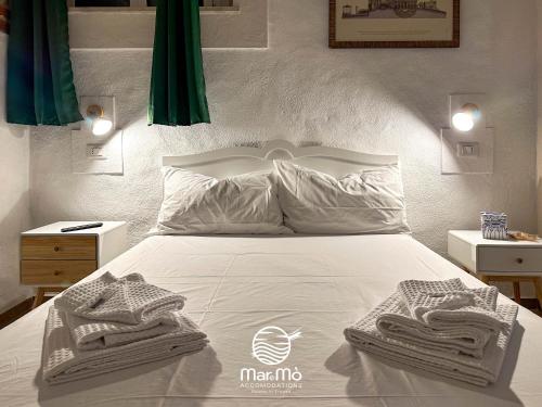Ein Bett oder Betten in einem Zimmer der Unterkunft MareMò Accomodations - Rooms in Tropea