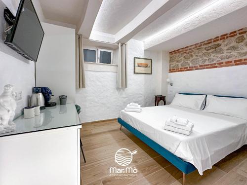 Ein Bett oder Betten in einem Zimmer der Unterkunft MareMò Accomodations - Rooms in Tropea