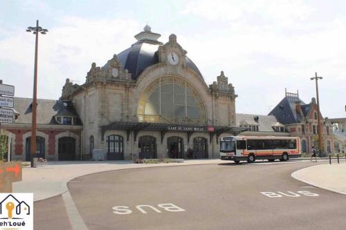 a bus is parked in front of a building at Ulyssee Seh’Loué in Saint-Brieuc