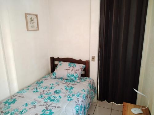 Una cama o camas en una habitación de Granja Triple A