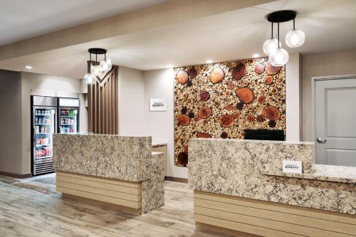 a lobby of a store with marble counter tops at TownePlace Suites by Marriott Show Low in Show Low