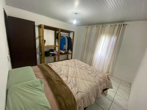 Ένα ή περισσότερα κρεβάτια σε δωμάτιο στο Casa de veraneio