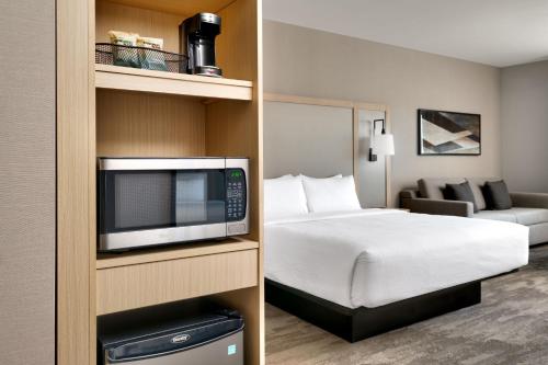 a hotel room with a bed and a tv at Fairfield by Marriott Inn & Suites Show Low in Show Low