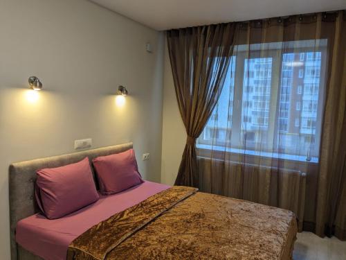 Giường trong phòng chung tại ALIANCE апартамети в центрі міста.
