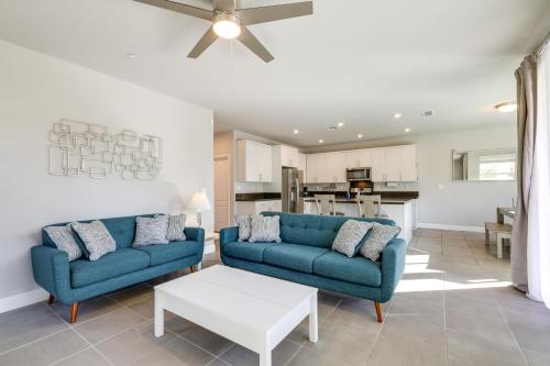 a living room with two blue couches and a table at Stylish Lodi Wine Country Retreat with Private Patio in Lodi