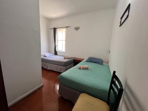 Postel nebo postele na pokoji v ubytování Hostal Arlegui - Viña Centro