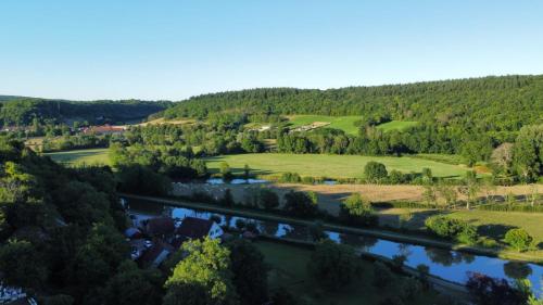 an aerial view of a river and a village at Gîte du Flotteur in Chevroches