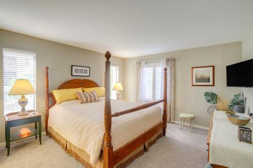 a bedroom with a large bed and a tv at Cathedral City Condo with Community Pools and Hot Tubs in Cathedral City