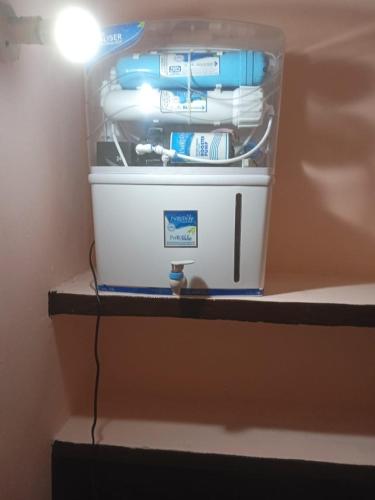 a refrigerator with a container filled with toothbrushes at lalit cottage central town, phagwara in Phagwāra