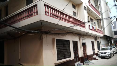 a building with a balcony on the side of it at lalit cottage central town, phagwara in Phagwāra