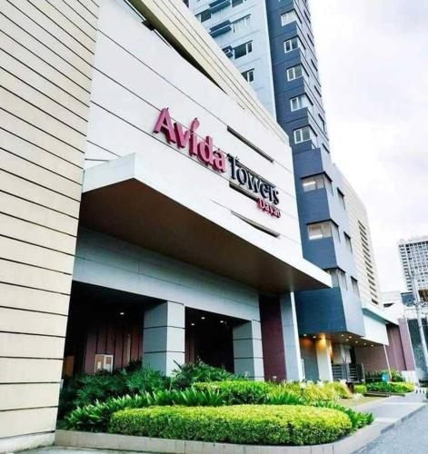 a building with an alexis towers sign on it at Avida Towers Davao City by darpm in Davao City
