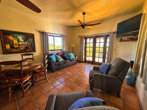 a living room with a couch and a table at Private Home with Pool and Spa - Kayaks, Quad Rental in Las Palmas