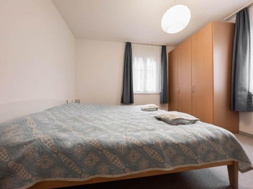 Un pat sau paturi într-o cameră la Chalet Wassermandli