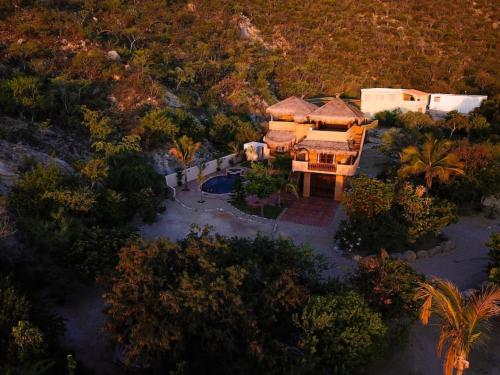 an aerial view of a house with a yard at Private Home with Pool and Spa - Kayaks, Quad Rental in Las Palmas