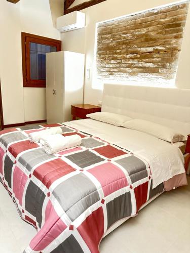 Cama o camas de una habitación en Venice Rainbow Apartments San Zaccaria 2