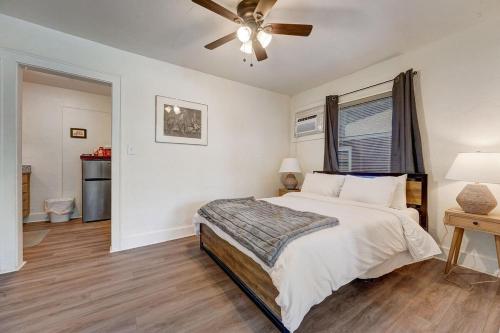a bedroom with a bed and a ceiling fan at Enchanting Home In Ideal Downtown Location in Oklahoma City