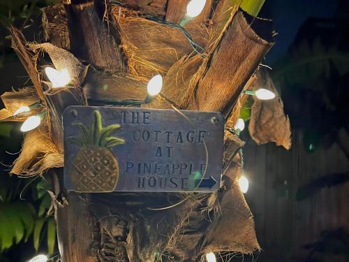 a sign that reads the coffee at pineapple house at The Cottage at Pineapple House in West Palm Beach