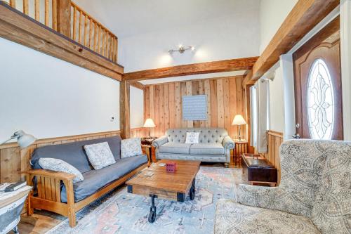 a living room with a couch and a table at Jones Mills Vacation Rental Near Skiing and Hiking! 