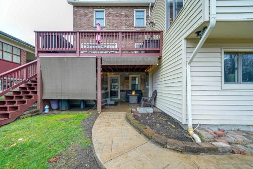 a house with a pink deck and a patio at Beckley Studio with Private Hot Tub and Home Gym! in Beckley