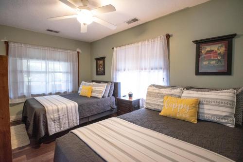 a bedroom with two beds and a window at Harper Valley Cottage in Nashville