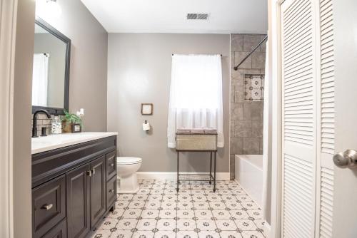 a bathroom with a sink and a toilet and a shower at Harper Valley Cottage in Nashville