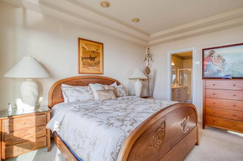 a bedroom with a large wooden bed and a dresser at Arbor House South in Yachats