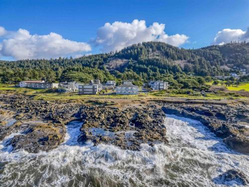 an aerial view of the shoreline of a resort at Arbor House North in Yachats