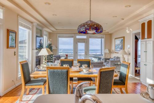 a dining room with a table and chairs at Arbor House in Yachats