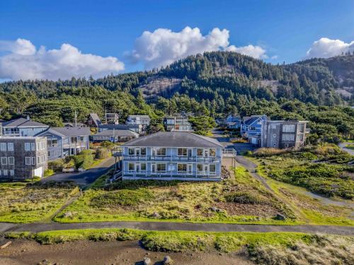an aerial view of a town with houses and mountains at Arbor House in Yachats