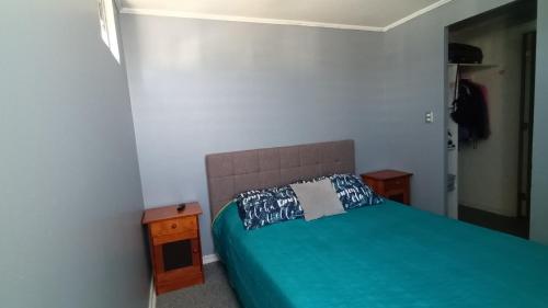 a bedroom with a bed with a pillow on it at Departamento 3d y 2b condominio mistral oriente 2 in La Serena
