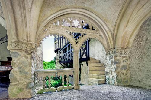 a room with a staircase in a building with a stair case at Thorngrove Manor in Stirling