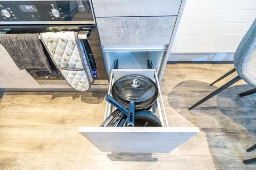 a room with a bed with a toilet in a box at City Escape - Unwind in Style in Barking