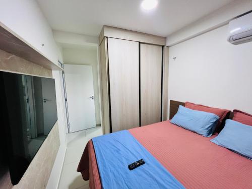 a bedroom with a bed and a sliding glass door at Apartamento novo zona leste. in Teresina