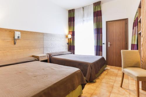 Säng eller sängar i ett rum på Hotel Avana Mare