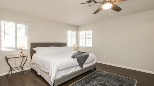 a white bedroom with a bed and a ceiling fan at Scottsdale Kierland 3 Bdrm with Sparkling Pool in Scottsdale