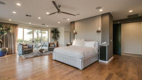 a bedroom with a bed and a living room at Stunning Private and Modern N Scottsdale Estate in Scottsdale