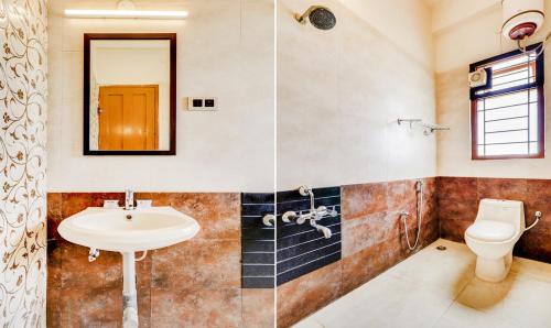a bathroom with a sink and a toilet at royal stay in Madurai