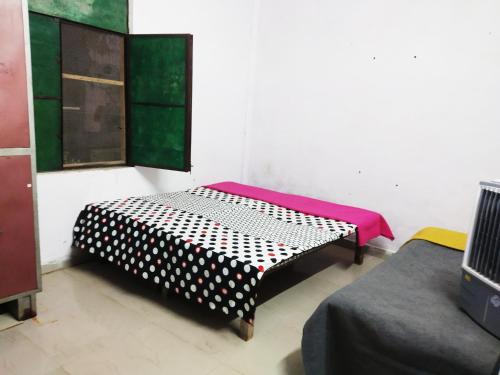 a room with two beds in a room at Baba Boys Hostel and Baba Trailer Truck Transport in Lucknow