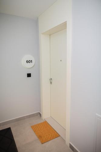a room with a door with a go sign on it at Belgrade Simfonia - One bedroom apartment in Belgrade