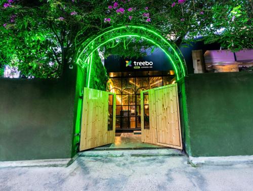 an entrance to a store with an open door at Treebo Trend Express Inn in Mumbai