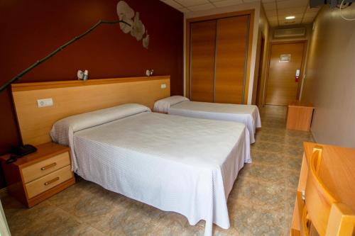 Postel nebo postele na pokoji v ubytování Hotel Mediterrani Blau