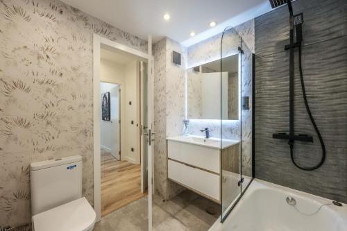 a bathroom with a shower and a sink at Luxury Plaza De Castilla in Madrid