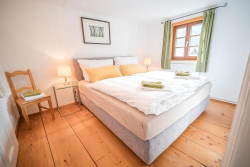 מיטה או מיטות בחדר ב-Villa Straussengut